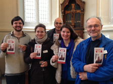 Bellringers presenting copies of the bells leaflet